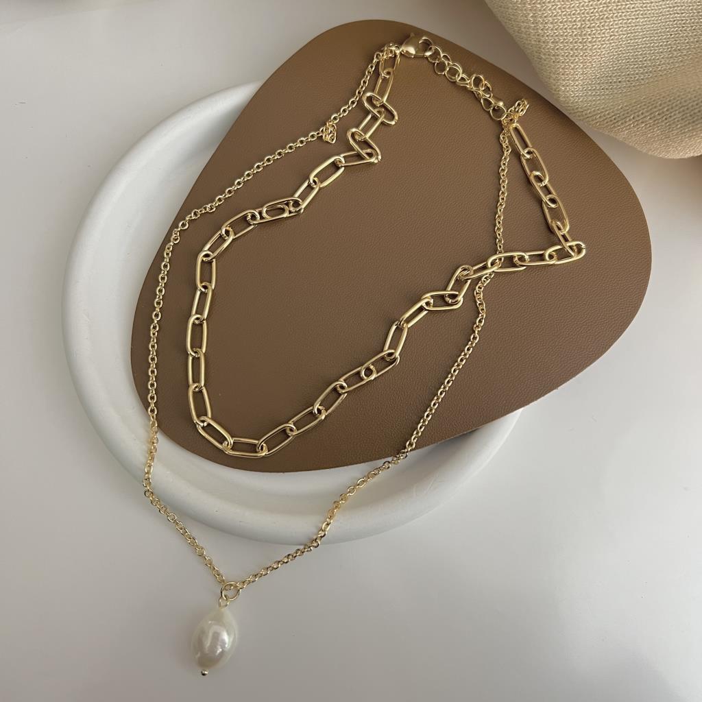 Twin chain necklace with freshwater pearl pendant in gold